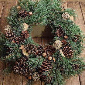 A wreath of fresh spruce needles with winter accessories, 30 cm