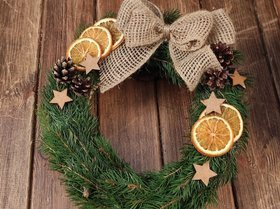 A wreath of fresh spruce needles with winter accessories, 30 cm